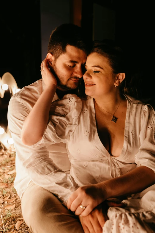 a man and a woman sitting next to each other, intimate lighting, cotton, promo image, cosy