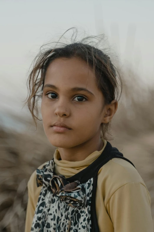 a little girl that is standing in the dirt, trending on unsplash, hurufiyya, portrait of bedouin d&d, portrait. 8 k high definition, portrait of a young teenage girl, from egypt