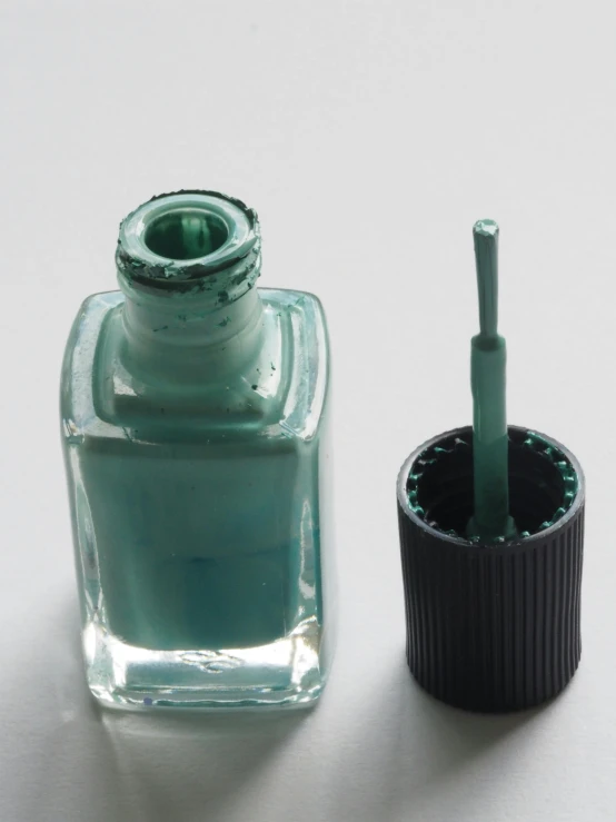 a bottle of nail polish next to a brush, inspired by Raoul De Keyser, ((greenish blue tones)), 1996), green: 0.25, washed out color