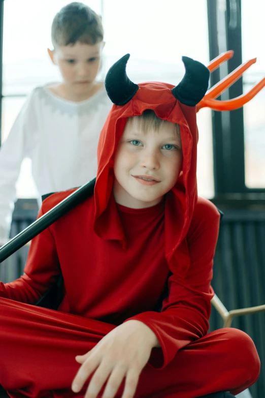 a little boy dressed up in a devil costume, pexels, movie still of the alien girl, teen boy, 15081959 21121991 01012000 4k, caspar david