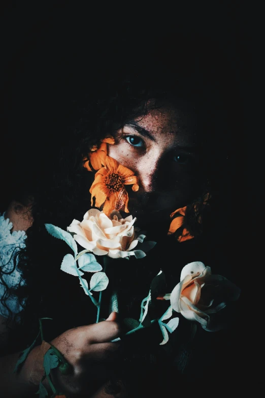 a woman holding a bouquet of flowers in front of her face, inspired by Elsa Bleda, with haunted eyes and curly hair, portrait of crazy post malone, unsplash photography, high contrast chiaroscuro