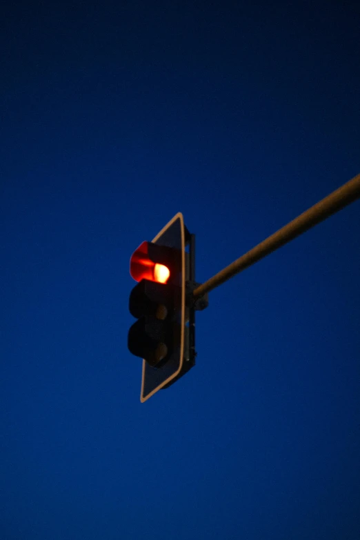 a close up of a traffic light with a blue sky in the background, flickr, square, late night, ap news photo, reddish