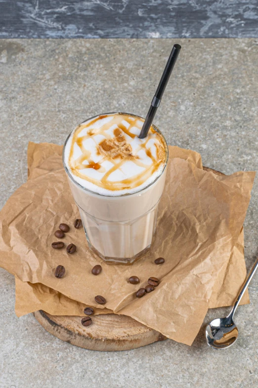 a cup of coffee sitting on top of a table, milkshake, detailed product image, caramel, thumbnail