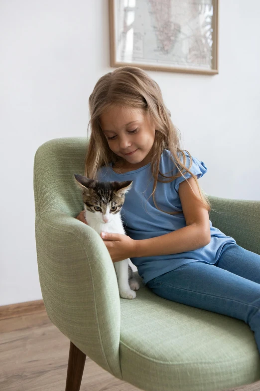 a little girl sitting in a chair with a cat, a picture, by Jan Tengnagel, shutterstock contest winner, incoherents, cuddling her gremlings, soft volume absorbation, teenager girl, product introduction photo