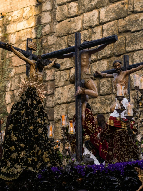 a statue of jesus on the cross in front of a stone wall, a statue, by Alejandro Obregón, pexels contest winner, renaissance, fallas party figures, the three marys at the sepulchre, black and yellow and red scheme, square