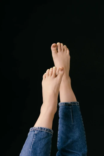 a person with their feet up in the air, trending on pexels, hyperrealism, albino skin, height detailed hd realistic 8 k, unclipped fingernails, plain background