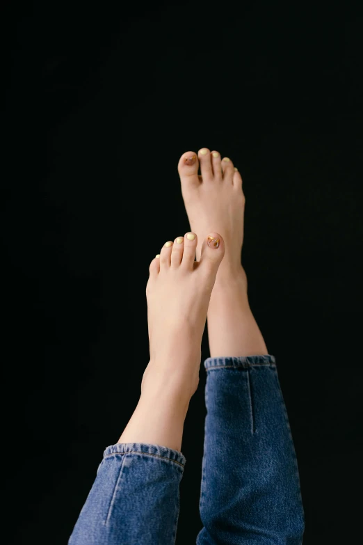 a person with their feet up in the air, trending on pexels, hyperrealism, albino skin, height detailed hd realistic 8 k, unclipped fingernails, plain background