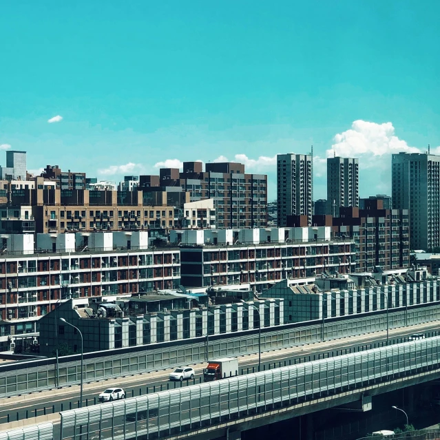 a city filled with lots of tall buildings, unsplash, brutalism, baotou china, photo on iphone, bright summer day, all buildings on bridge