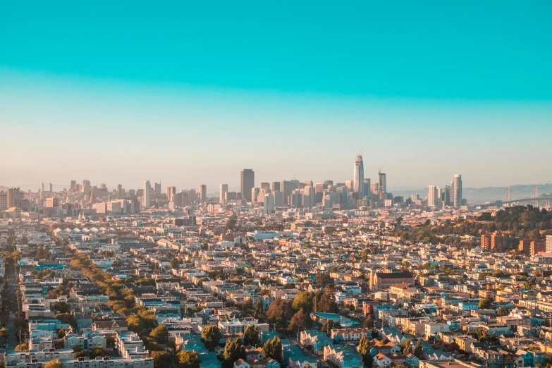 a view of a city from the top of a hill, by Carey Morris, unsplash contest winner, happening, clear blue skies, sf, teal aesthetic, background image