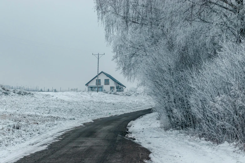 a snow covered country road with a house in the background, by Adam Marczyński, pexels contest winner, postminimalism, scary sharp icy, russian landscape, grey, 2000s photo