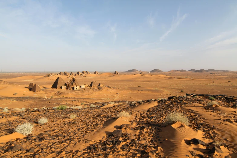 a view of the desert from the top of a hill, by Dietmar Damerau, les nabis, tall stone spires, scattered islands, red sand, geodesic domes