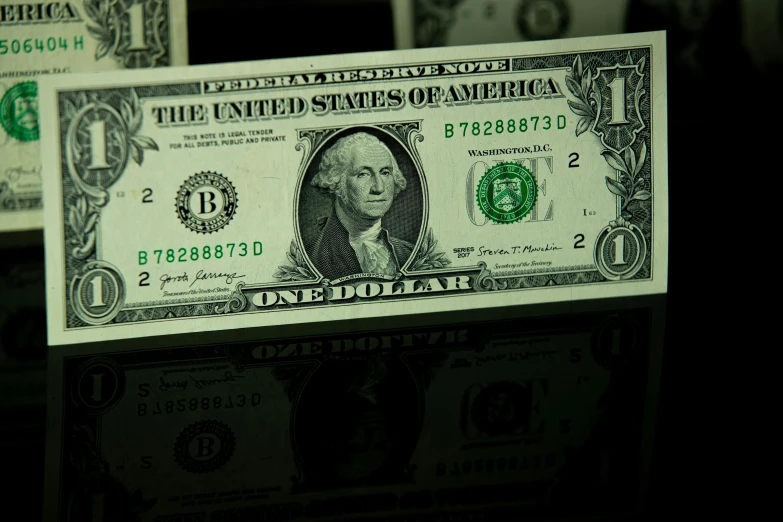 a one dollar bill sitting on top of a table, by Tom Carapic, unsplash, black and teal paper, a green, slide show, promo image