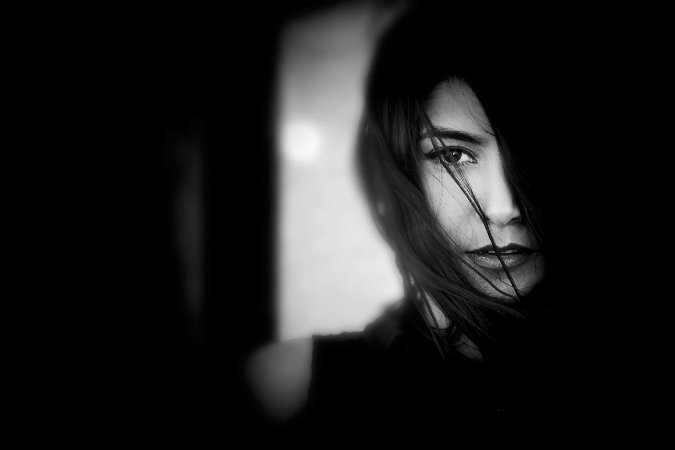 a black and white photo of a woman's face, a black and white photo, by Karl Buesgen, conceptual art, melancholy lighting, portrait of female rogue, brunette woman, taken with a pentax k1000