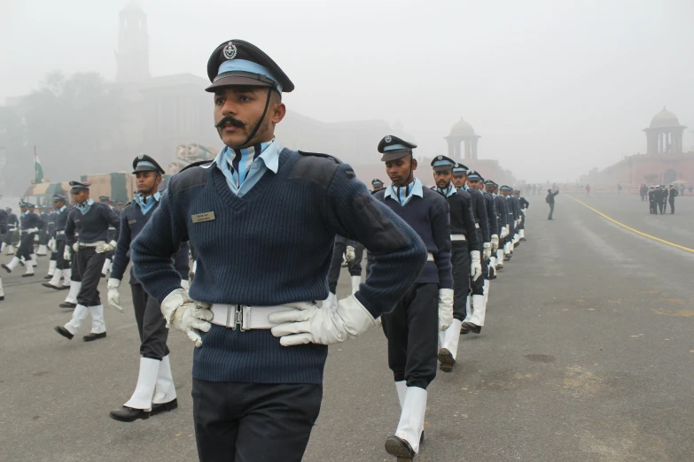 a group of men in uniform marching down a street, visual art, travelling through misty planes, indiecraft aesthetic, profile image, afp