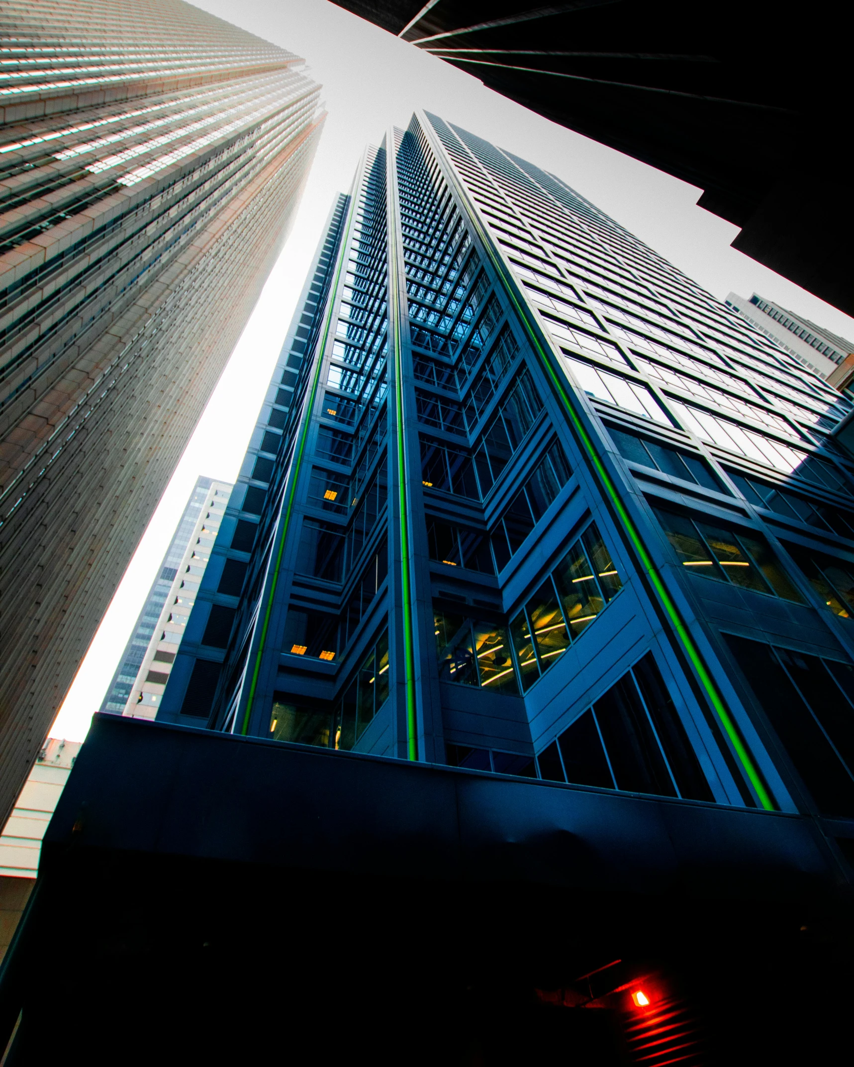 a tall building with a traffic light in front of it, award - winning photo ”, thumbnail, wall street, eyelevel perspective image