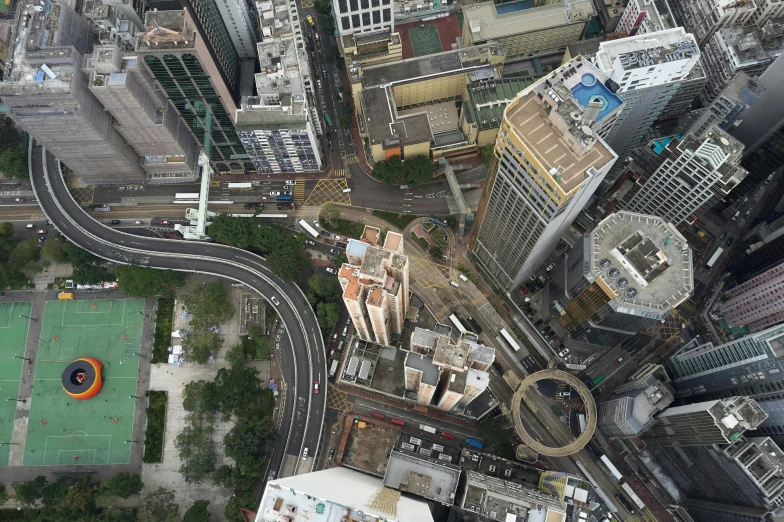 a large city filled with lots of tall buildings, inspired by Thomas Struth, pexels contest winner, photorealism, avenida paulista, bird\'s eye view, square, skybridges