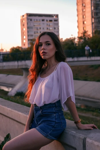a beautiful young woman sitting on top of a cement wall, inspired by Elsa Bleda, pexels contest winner, renaissance, standing on a bridge, crop top, early evening, anna nikonova aka newmilky
