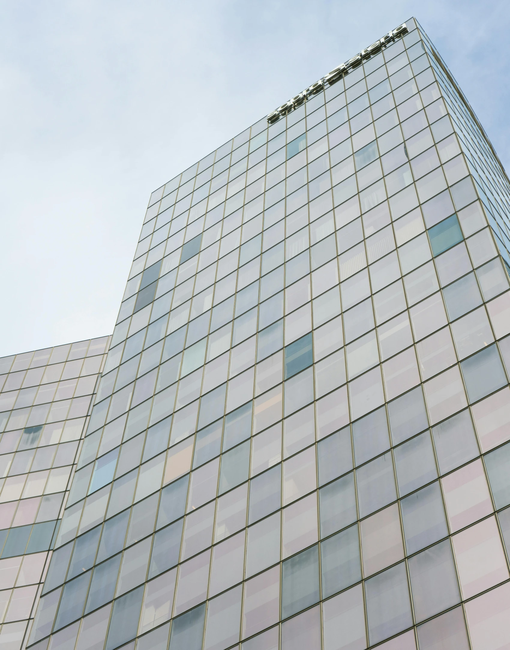 a very tall building with lots of windows, an album cover, inspired by David Chipperfield, unsplash, translucent pastel panels, mosaic, closeup photo, located in hajibektash complex