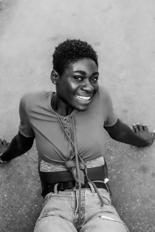 a black and white photo of a woman laying on the ground, by Lily Delissa Joseph, brown skin man with a giant grin, 2019 trending photo, emmanuel shiru, full body hero