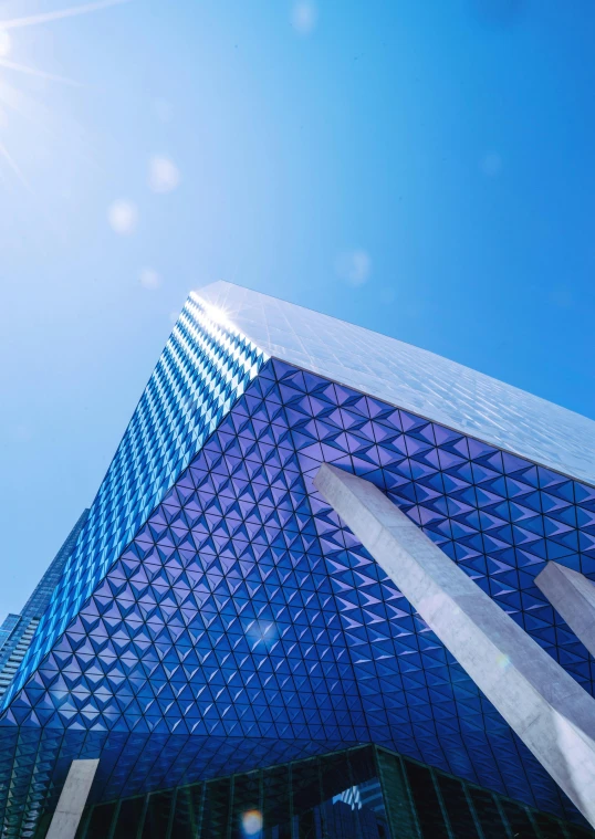 a very tall building with a lot of windows, pexels contest winner, hypermodernism, vibrant blue, pyramid visor, square, commercial banner