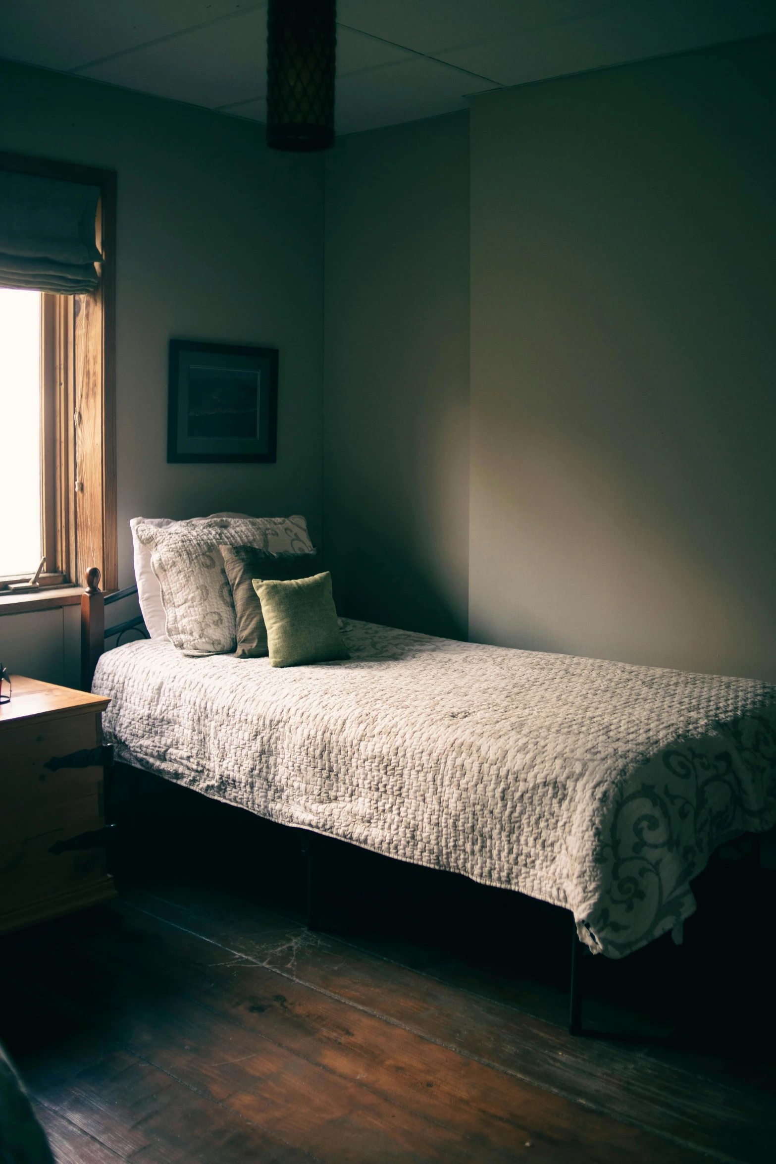 a couple of beds sitting in a bedroom next to a window, a portrait, unsplash, shaded lighting, college, dwell, small bed not made