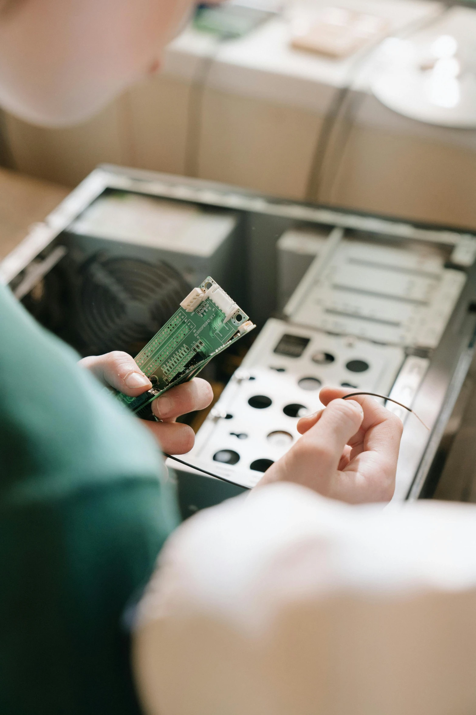 a close up of a person holding a cell phone, computer art, spaceship being repaired, 2019 trending photo, cash register, hdd