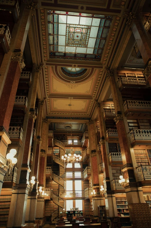 a large library filled with lots of books, iowa, national geographics, stunning grand architecture, shady