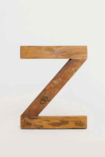 a wooden letter z on a white background, an abstract sculpture, by Joel Shapiro, unsplash, 2 5 6 x 2 5 6 pixels, reclaimed lumber, f / 2 0, high quality photo