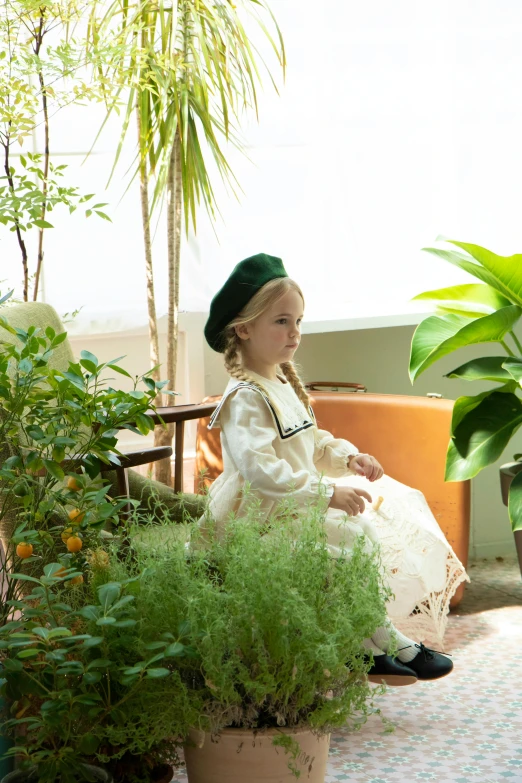a little girl sitting on a bench next to a potted plant, inspired by Elsa Beskow, unsplash, renaissance, terrarium lounge area, berets, with victorian clothing, green vegetation