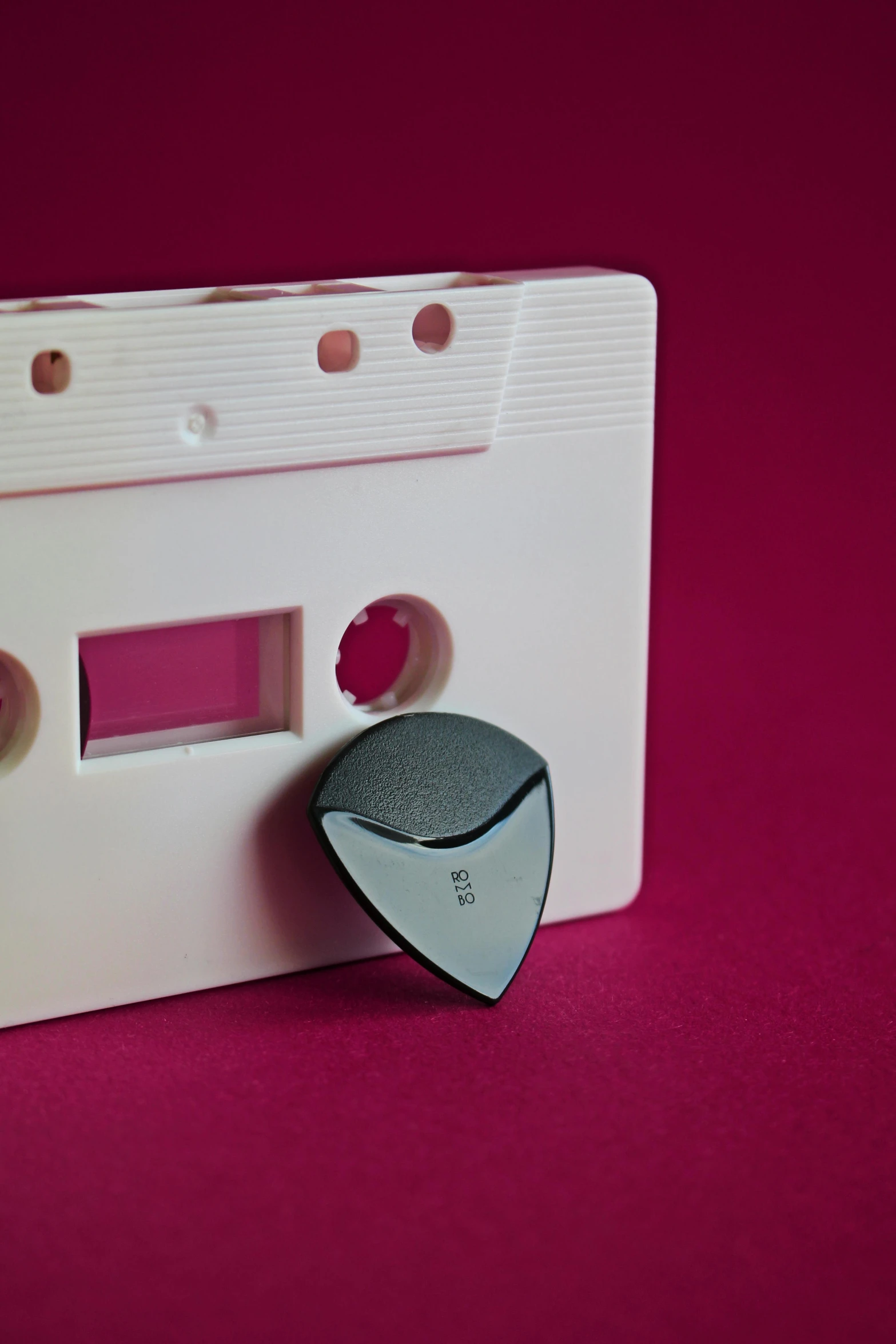 a white cassette player sitting on top of a pink surface, an album cover, pexels, private press, paul barson, sharply shaped, grey, 3 5 mm slide