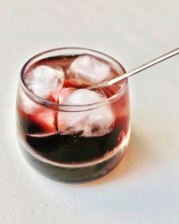 a close up of a drink in a glass with a spoon, some red and purple, cold as ice! 🧊, multiple stories, red wine