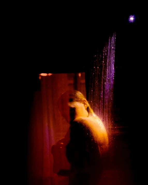 a woman standing in front of a shower head, inspired by Nan Goldin, renaissance, purple dim light, in the astral plane ) ) ), digital image