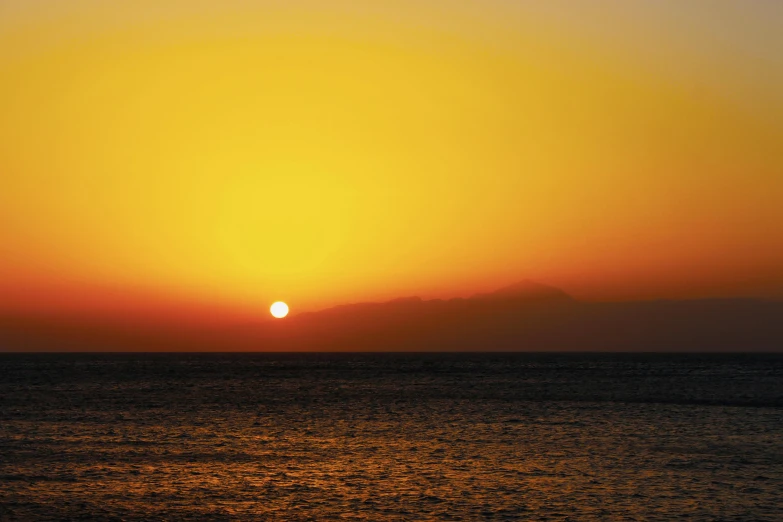 the sun is setting over a body of water, by Exekias, yellow, red sea, uncropped, from the distance