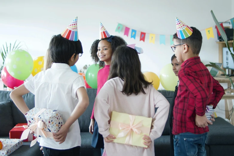 a group of children standing next to each other in a living room, pexels, happening, at a birthday party, avatar image, gifts, profile image