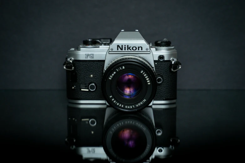 a camera sitting on top of a table, a picture, by Niels Lergaard, unsplash contest winner, photorealism, photo - realistic nikon 3 5 mm, 80s photo, highly polished, frontal shot
