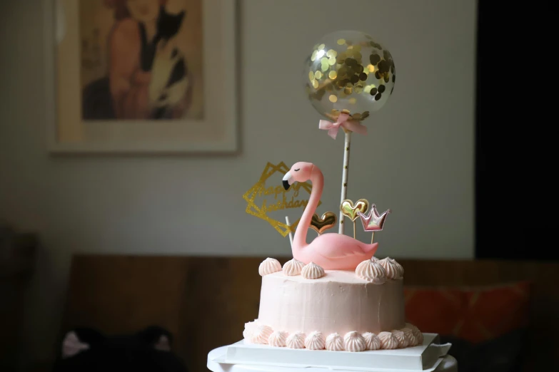 a pink cake sitting on top of a table, balloon, flamingo, thumbnail, low iso