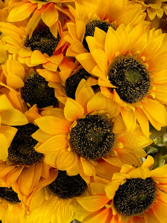 a vase filled with lots of yellow sunflowers, zoomed out view, hansa yellow, medium close up