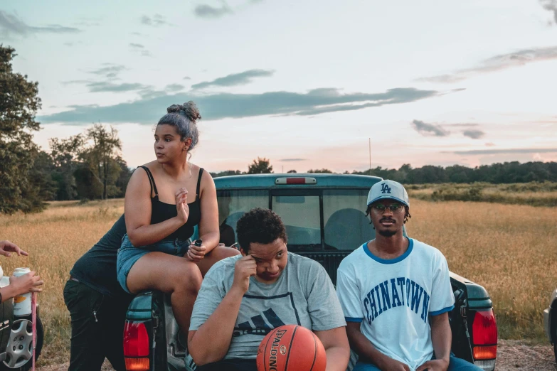 a group of people sitting on the back of a truck, an album cover, unsplash, basketball, midlands, profile pic, official music video