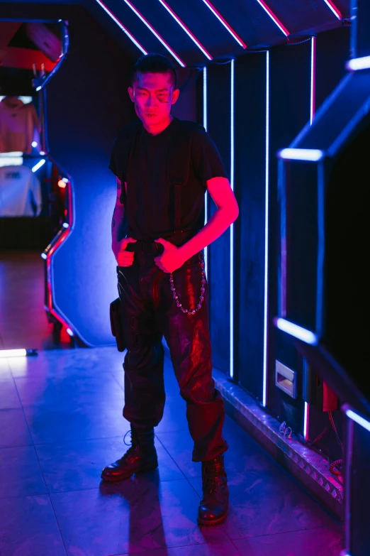 a man standing in a room with neon lights, wearing black sith uniform, terminator tech, on ship, lazertag