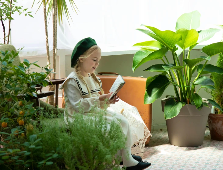 a little girl sitting on a bench reading a book, inspired by Elsa Beskow, unsplash, renaissance, big interior plants, terrarium lounge area, portrait image