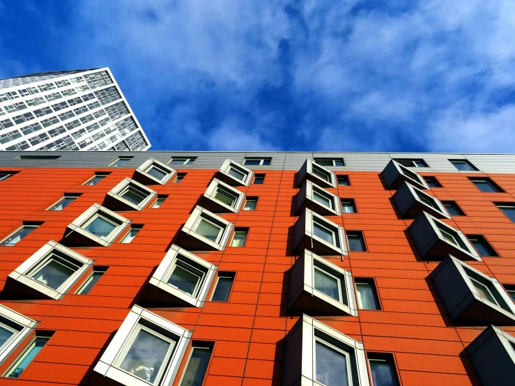 a tall red building with lots of windows, by Washington Allston, unsplash, bauhaus, orange grey white, slide show, square, 2040