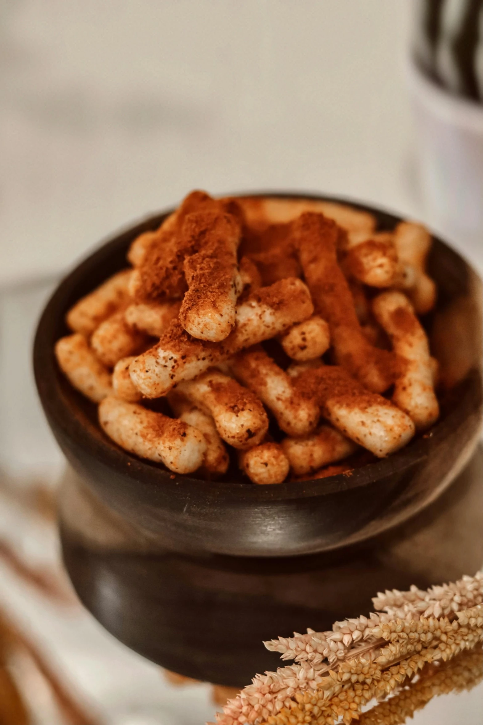 a close up of a bowl of food on a table, cinamtic, bumps, tiny sticks, thumbnail