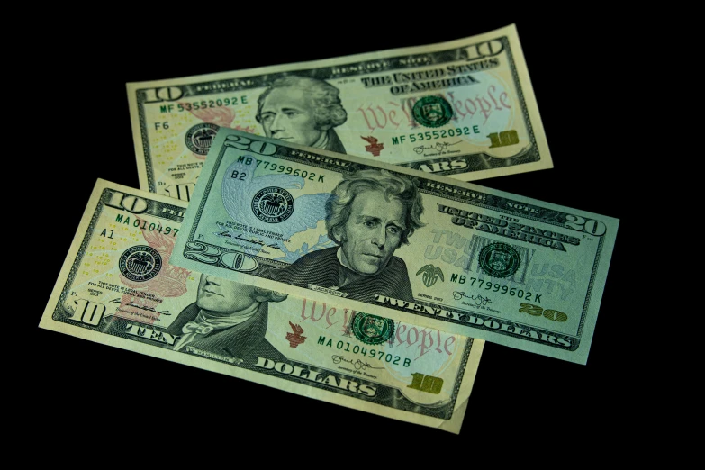 a bunch of money sitting on top of a table, with a black background, listing image, three views, 1 0 / 1 0