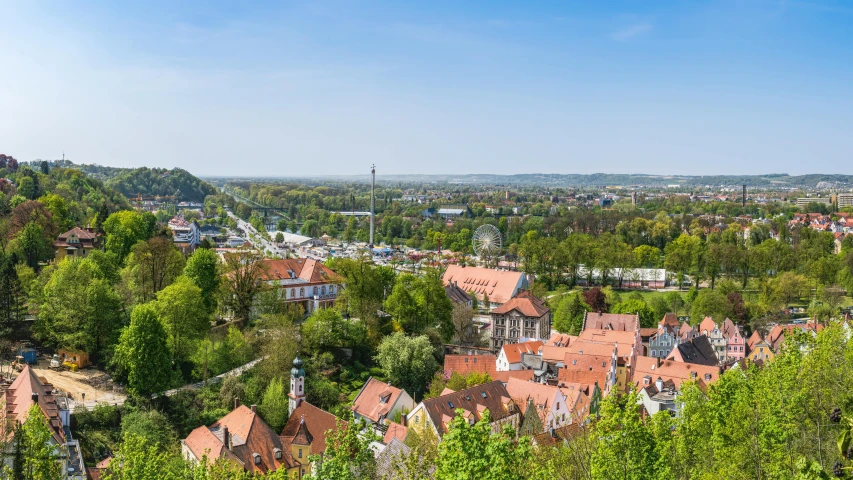 a view of a town from the top of a hill, by Jakob Gauermann, pexels contest winner, happening, lower saxony, square, istock, stålenhag