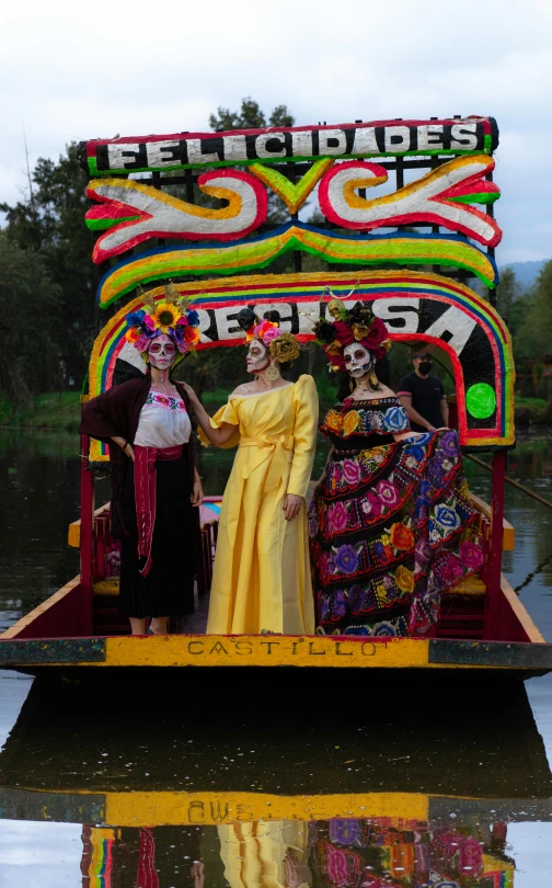 a group of people riding on top of a boat, by Carla Wyzgala, pexels contest winner, process art, dia de muertos dress and make up, canals, contest winner 2021, square