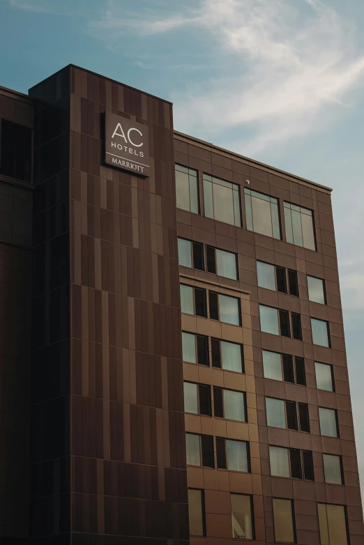 a tall building with a clock on top of it, acescg colorspace, brown, ap, hotel room