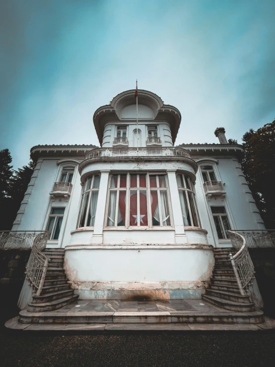 a very tall building with a lot of windows, an album cover, pexels contest winner, art nouveau, inter dimensional villa, wide angle exterior 2022, haunted, thumbnail