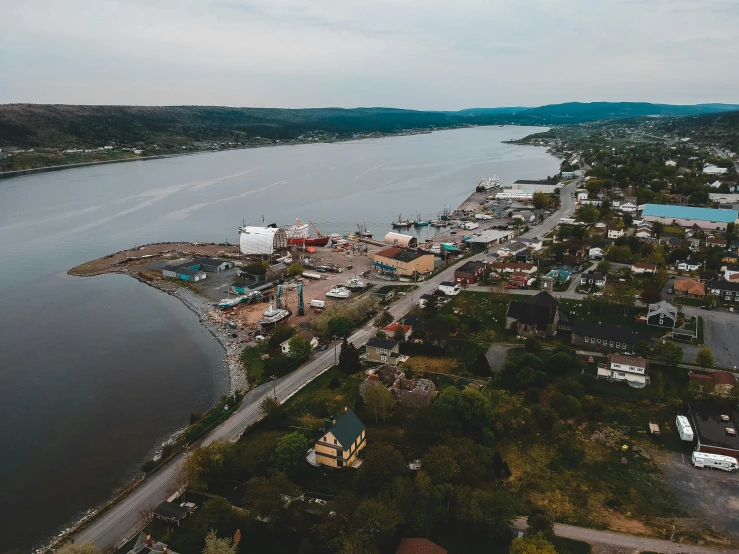 an aerial view of a large body of water, pexels contest winner, plein air, quebec, port scene background, small town surrounding, ultrawide angle cinematic view