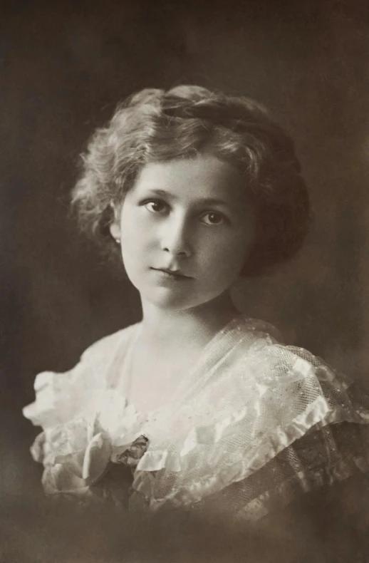 an old black and white photo of a woman, inspired by Beatrice Ethel Lithiby, queen elizabeth, young female face, brown, young blonde woman