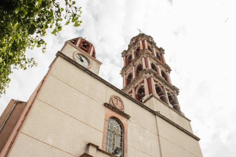 a tall building with a clock on the front of it, tlaquepaque, profile image, churches, fan favorite